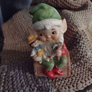 Elf Christmas porcelain figurine by Homco, Adorable holding doll